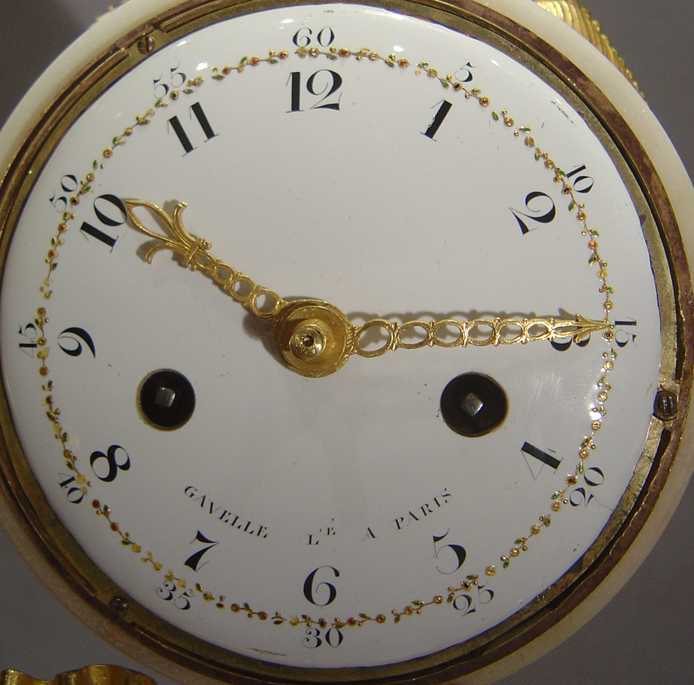 French antique Louis XVIth mantel clock in white and black marble with ormolu signed Gavelle.