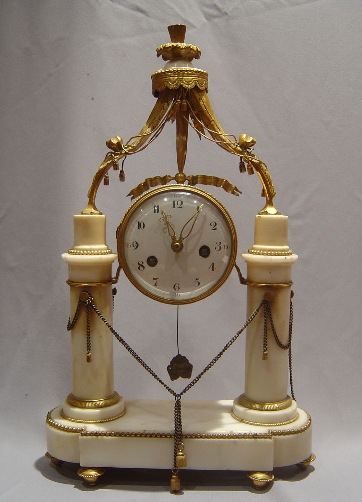 Louis XVIth white marble and ormolu mantel clock.