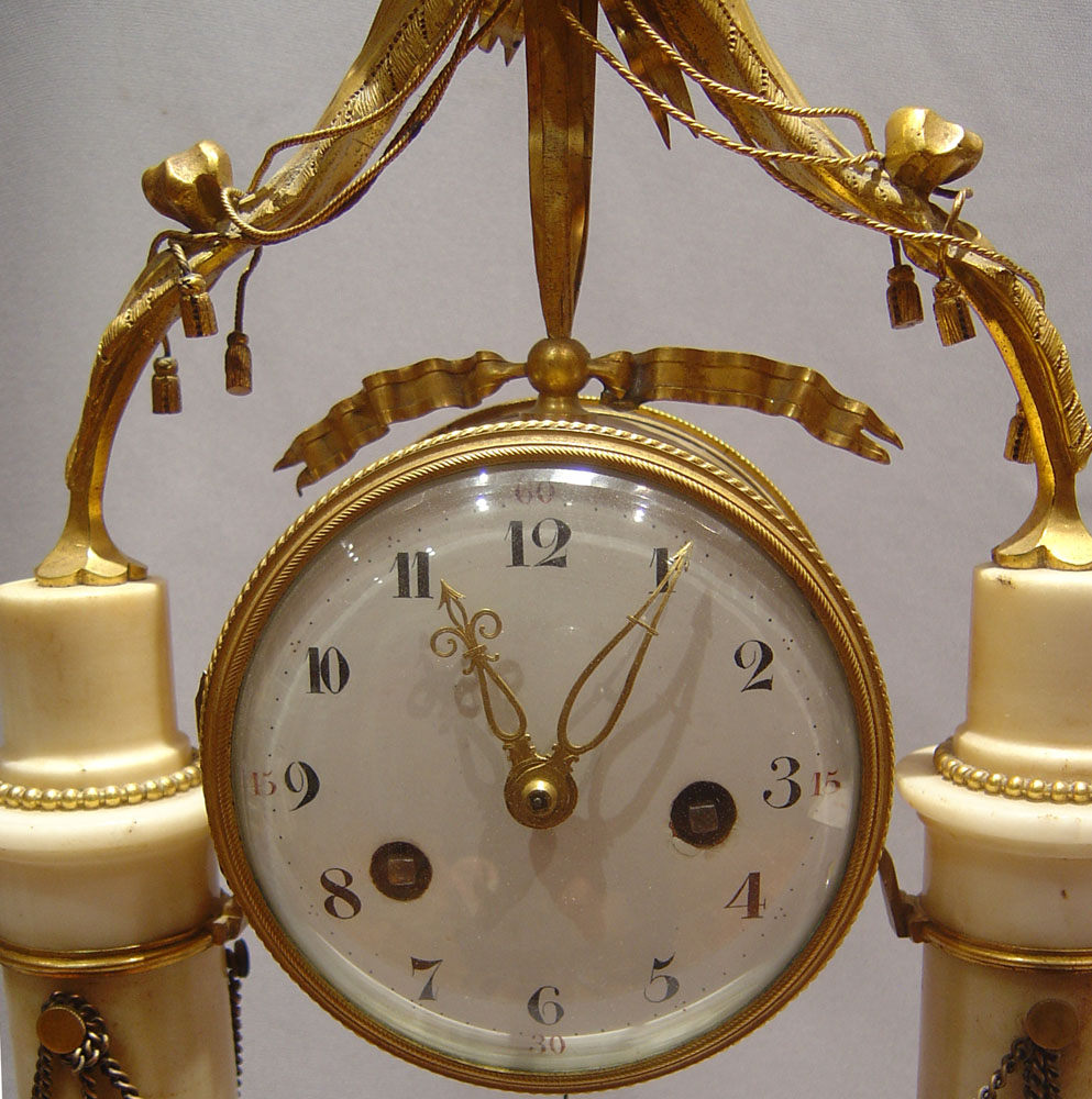 Louis XVIth white marble and ormolu mantel clock.