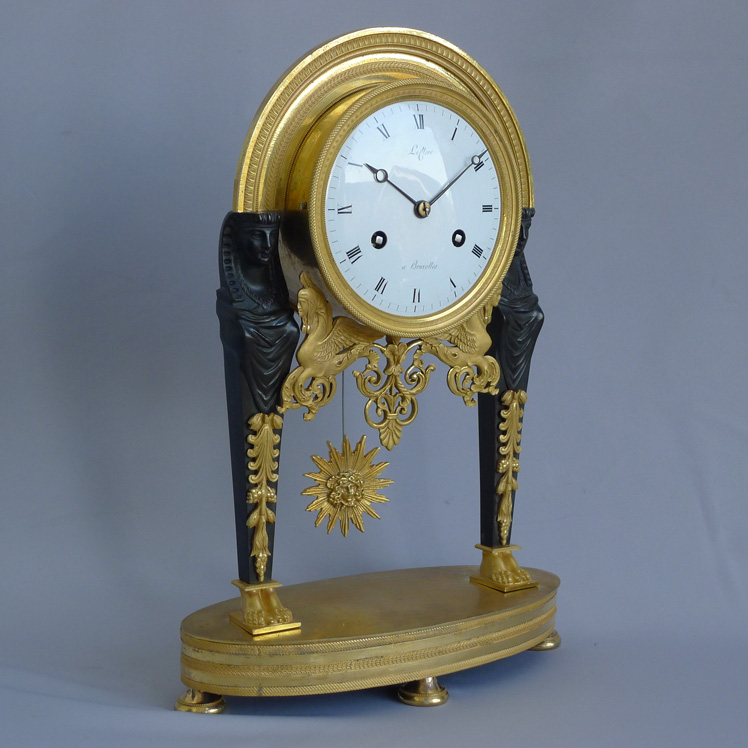 Antique French Directoire Egyptian style ormolu and patinated bronze mantel clock signed Leclerc.
