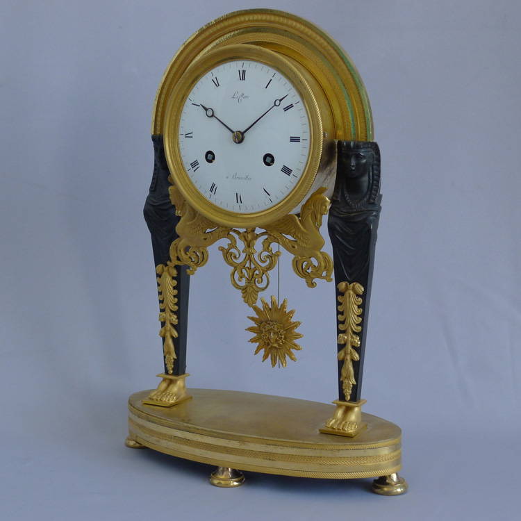Antique French Directoire Egyptian style ormolu and patinated bronze mantel clock signed Leclerc.