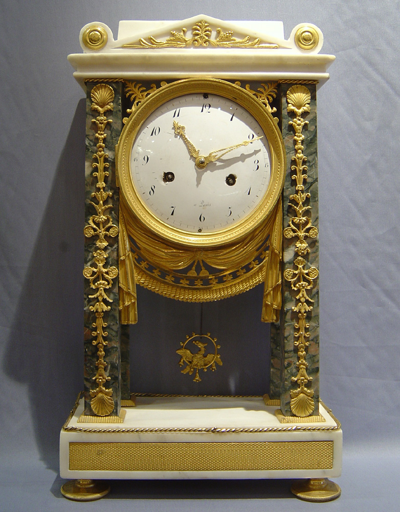 Antique French Directoire period mantel clock in ormolu & white & grey marble.