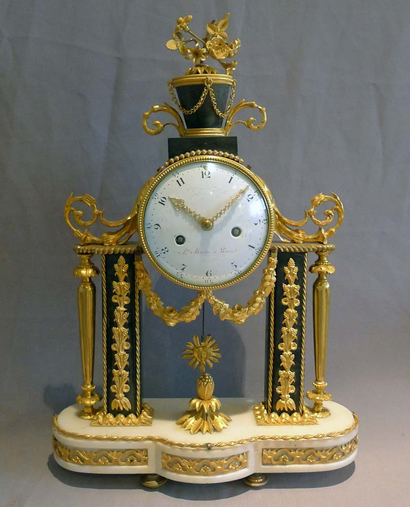 Antique French Louis XVI ormolu mounted white and grey marble mantel clock.