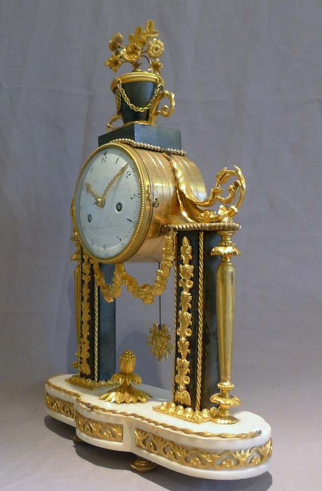 Antique French Louis XVI ormolu mounted white and grey marble mantel clock.
