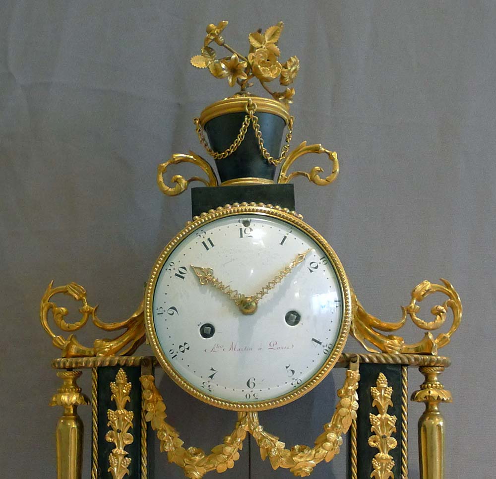 Antique French Louis XVI ormolu mounted white and grey marble mantel clock.