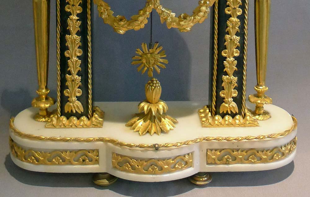 Antique French Louis XVI ormolu mounted white and grey marble mantel clock.
