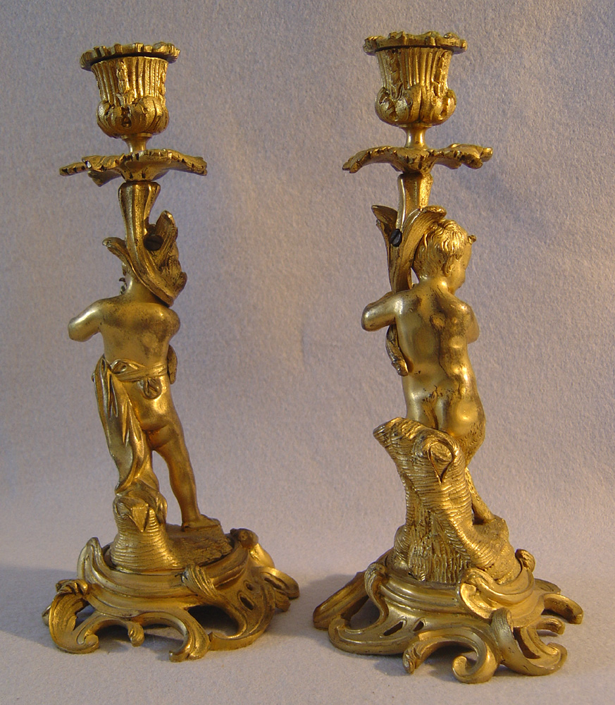Pair of antique French ormolu figural candlesticks.