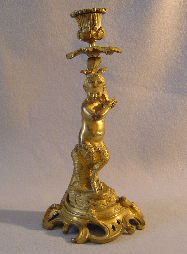 Pair of antique French ormolu figural candlesticks.