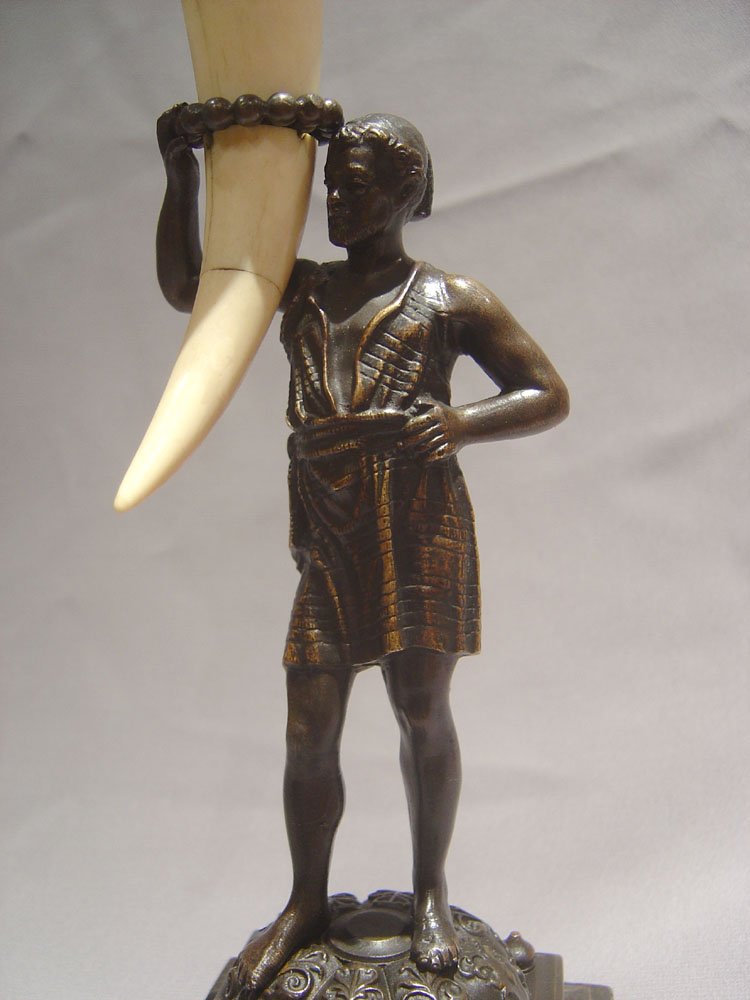 Antique blackamoor or negro candlesticks.