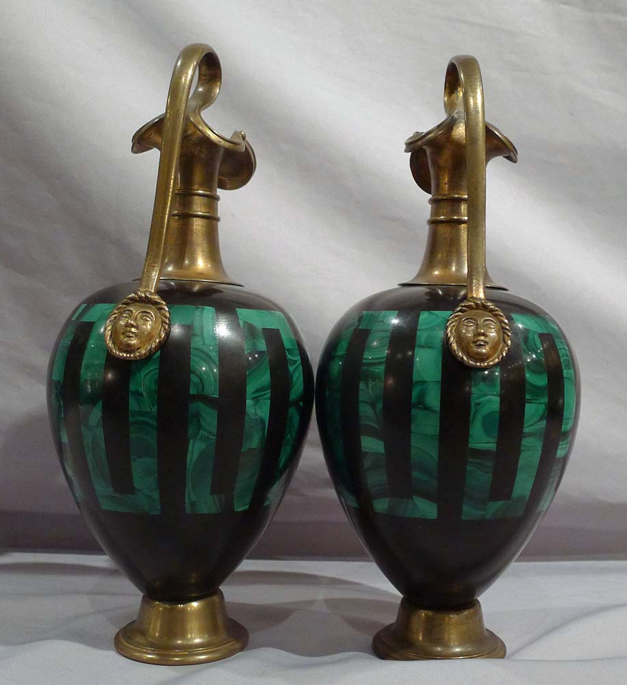 Antique pair of Russian malachite and black marble vases with ormolu mounts.