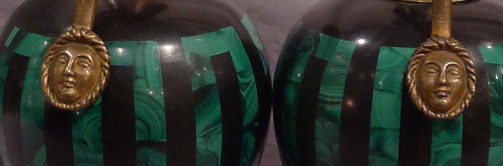 Antique pair of Russian malachite and black marble vases with ormolu mounts.