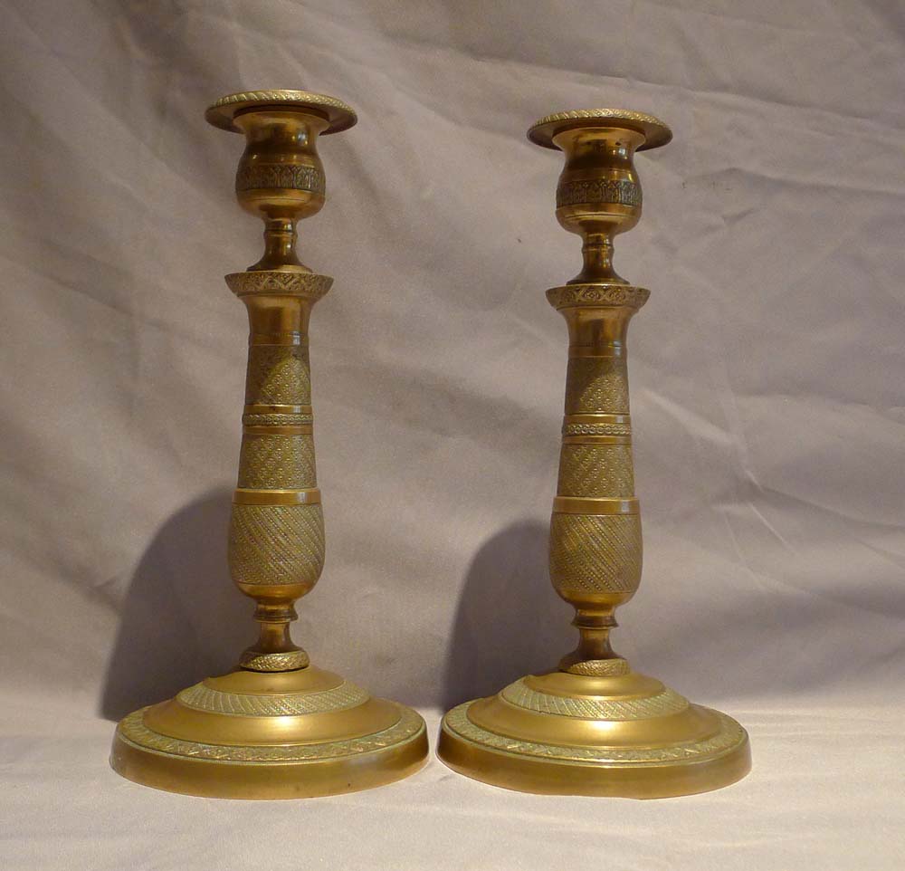 Pair of bronze candlesticks in the Empire style.