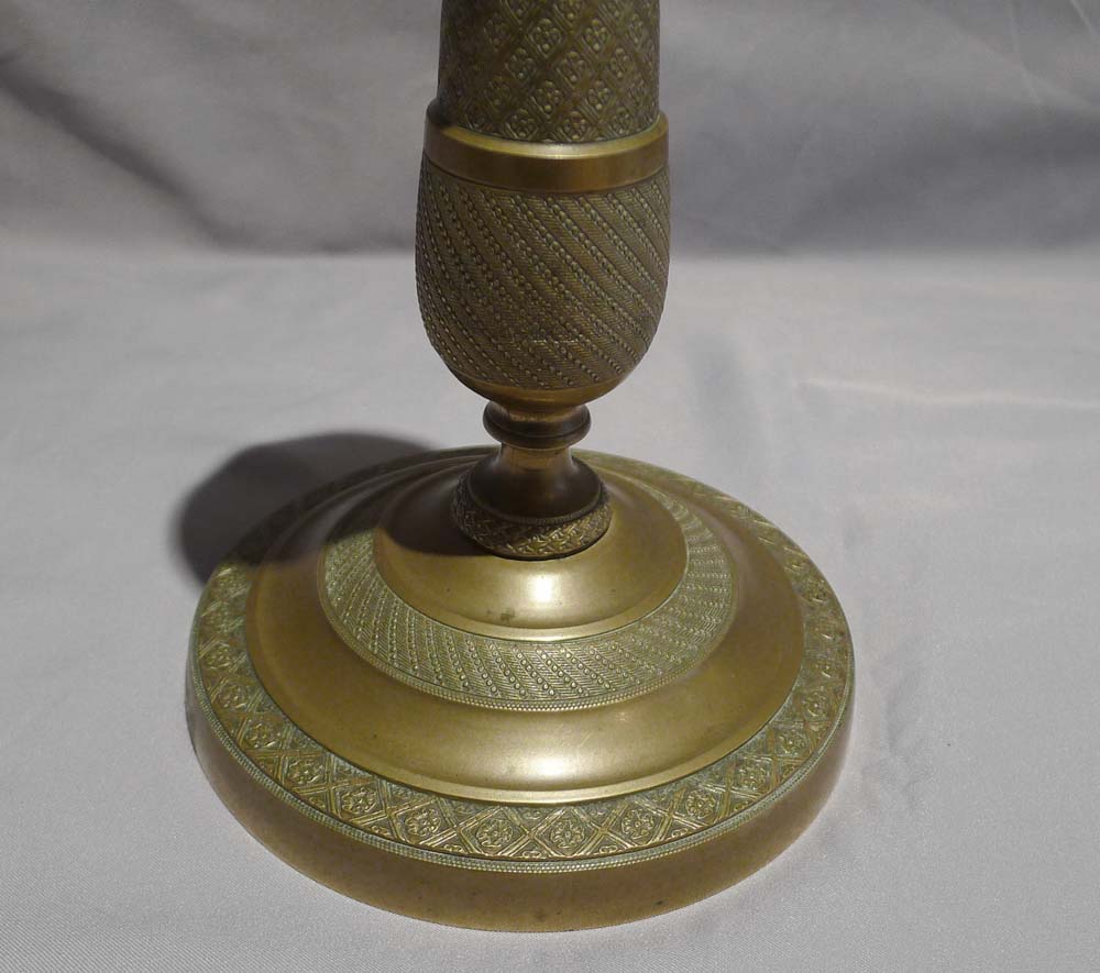 Pair of bronze candlesticks in the Empire style.