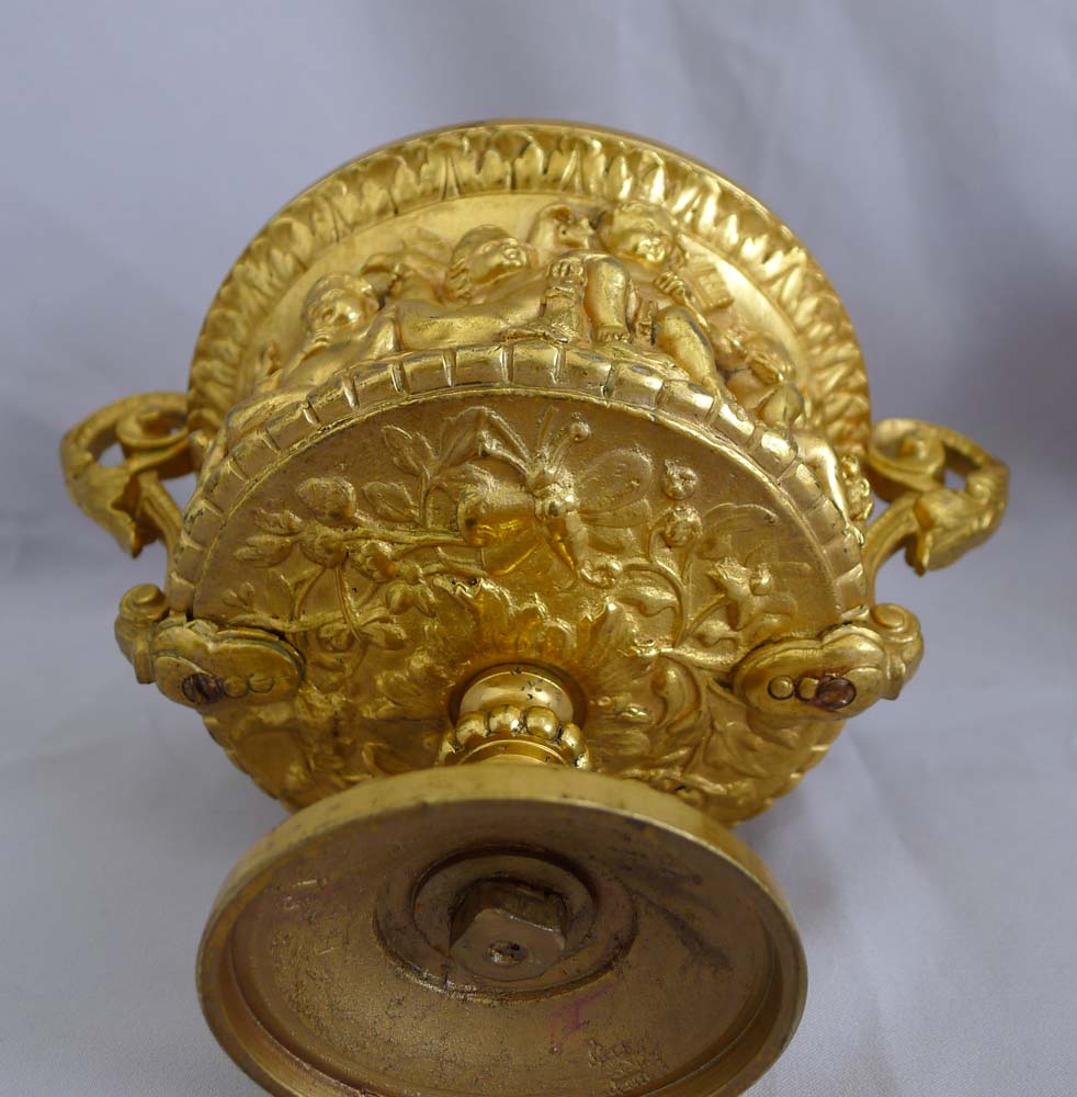 Antique pair of French gilt bronze tazzas with eight putti around the sides.