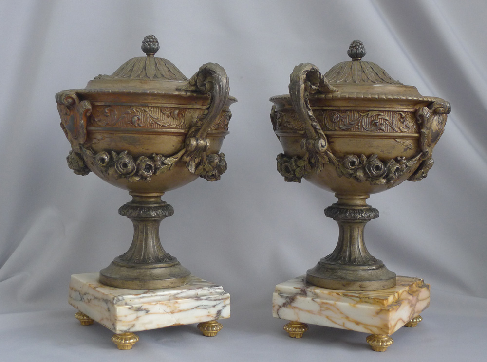 Antique pair of pewter Urns on marble base