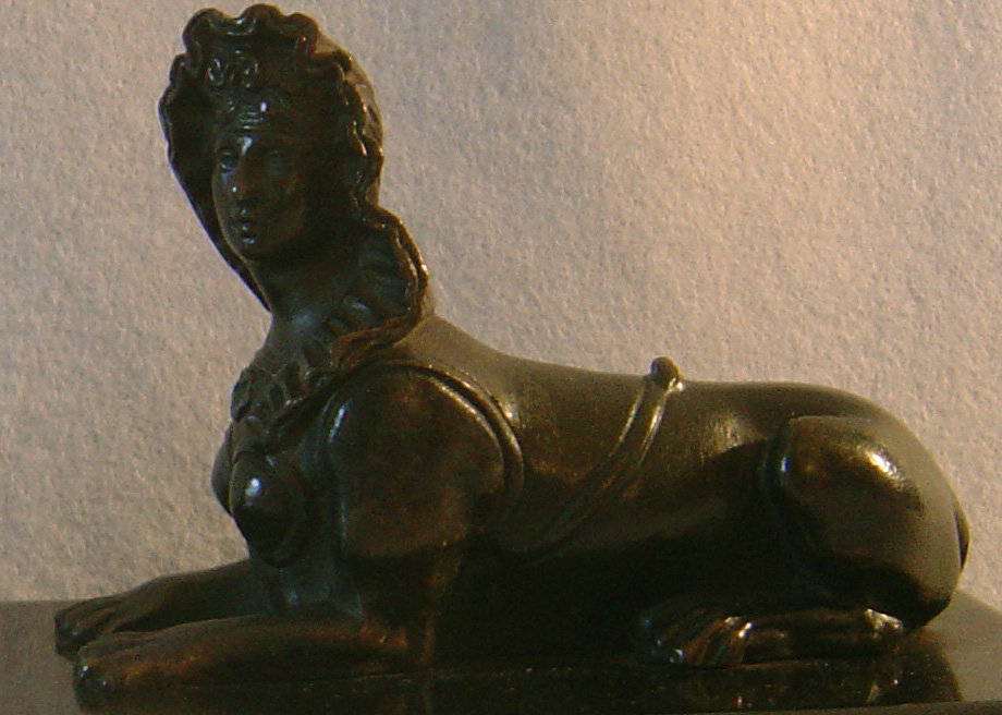 Antique pair of Grand Tour Sphinx on black marble bases.