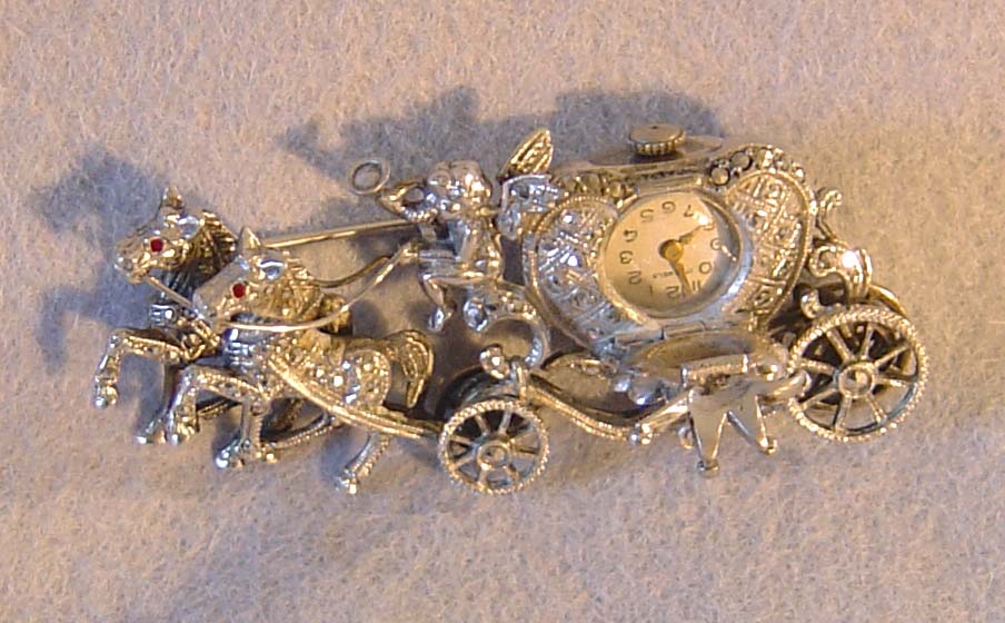 Silver and marquesite watch broach.