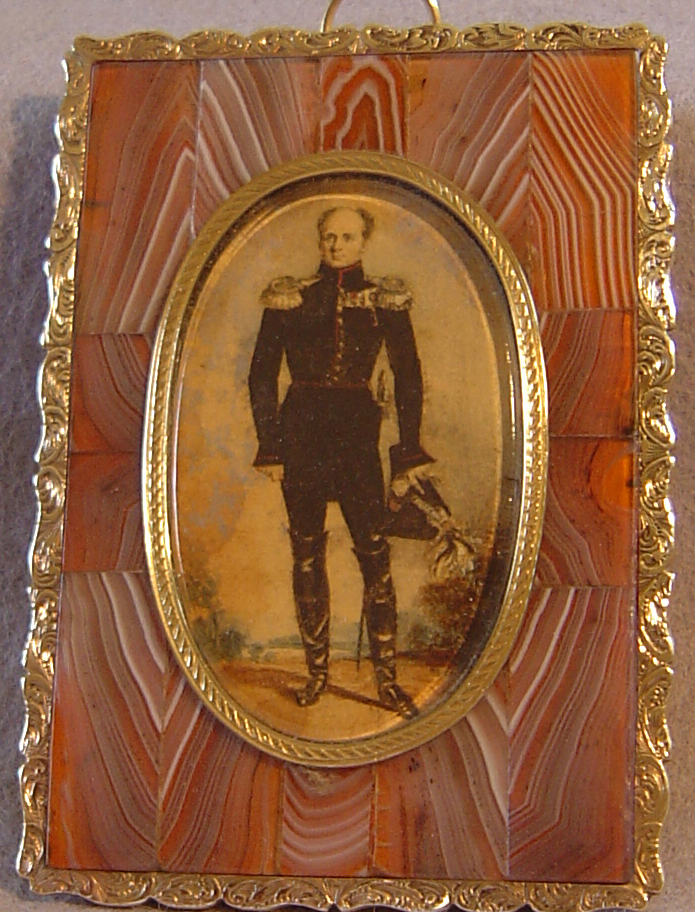 A miniature of an officer in a fine gold mounted split agate frame.
