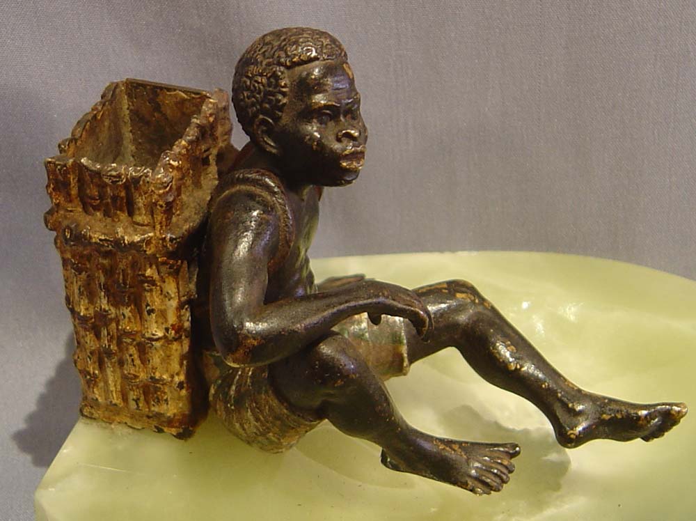 Austrian bronze of a negro match strike on a green onyx ashtray