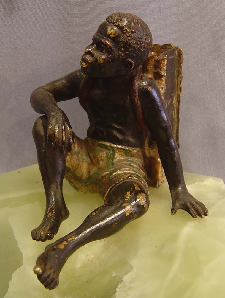 Austrian bronze of a negro match strike on a green onyx ashtray
