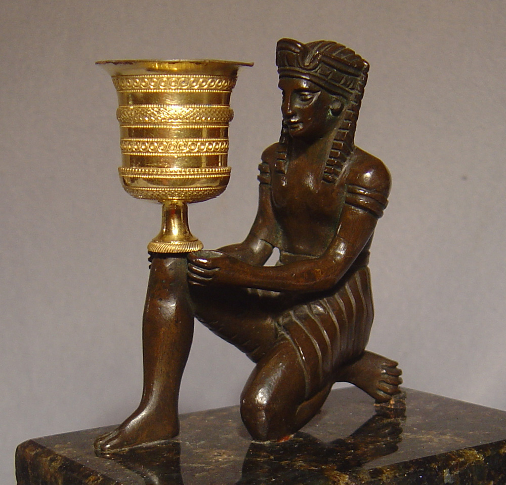 Antique French/English gout d'egypt patinated bronze and ormolu candlestick on felspar base.