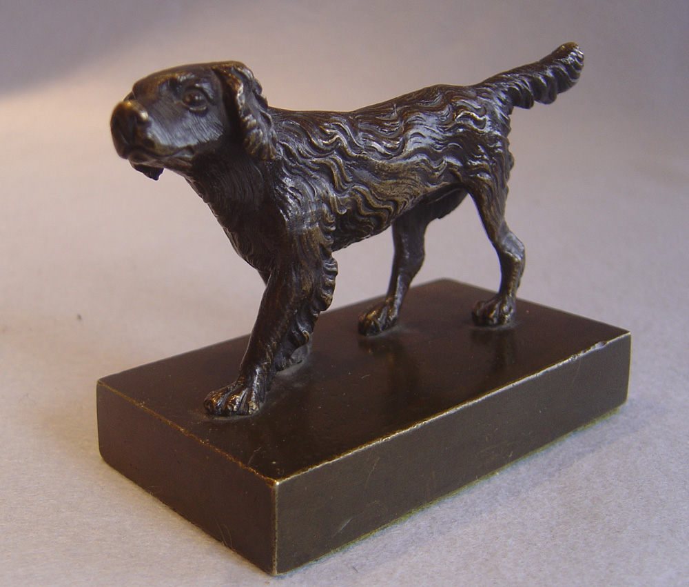 Antique English Regency patinated bronze of a Spaniel.
