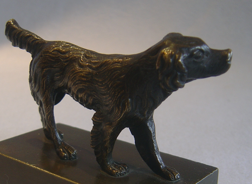 Antique English Regency patinated bronze of a Spaniel.