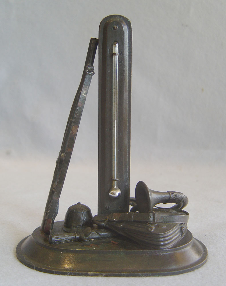 Antique English thermometer as part of a hunting scene.