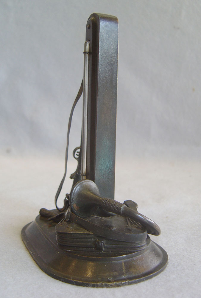 Antique English thermometer as part of a hunting scene.