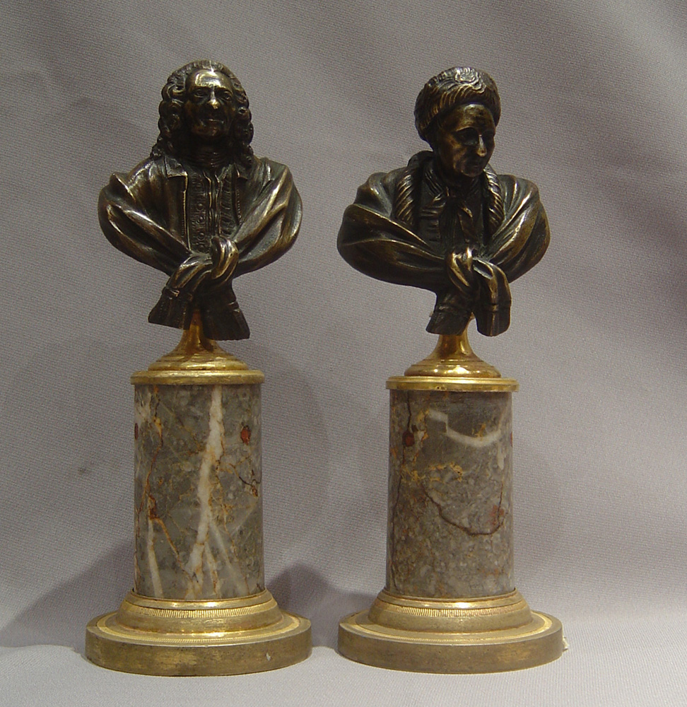 Antique bronze busts of Voltaire and Rousseau on fine ormolu mounted marble bases.