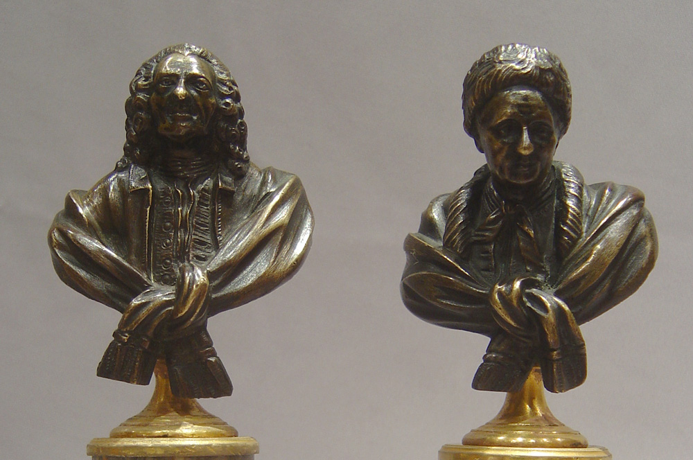 Antique bronze busts of Voltaire and Rousseau on fine ormolu mounted marble bases.
