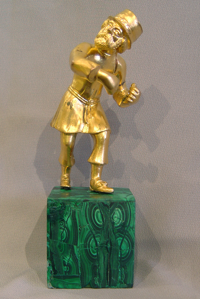 Russian gilt bronze figure of an old man on Siberian malachite base.
