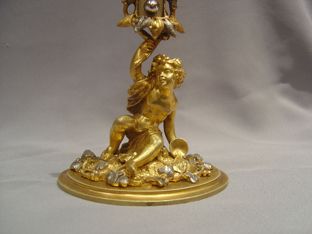 A fine mid 19th century silvered and gilded ormolu thermometer.