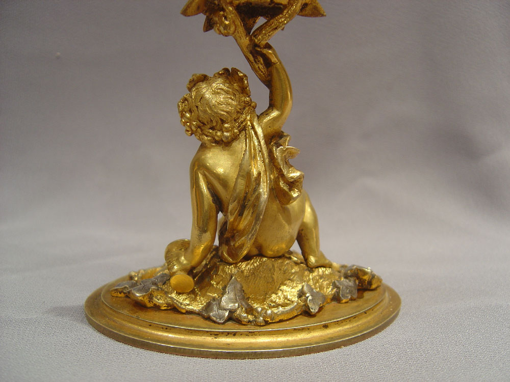 A fine mid 19th century silvered and gilded ormolu thermometer.