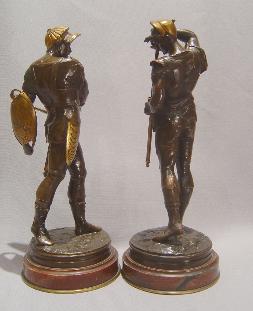 Pair French bronze gladiators on marble bases by Lalouette.
