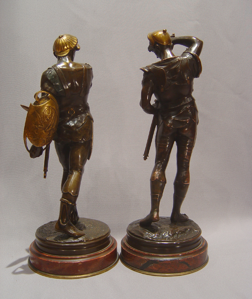 Pair French bronze gladiators on marble bases by Lalouette.