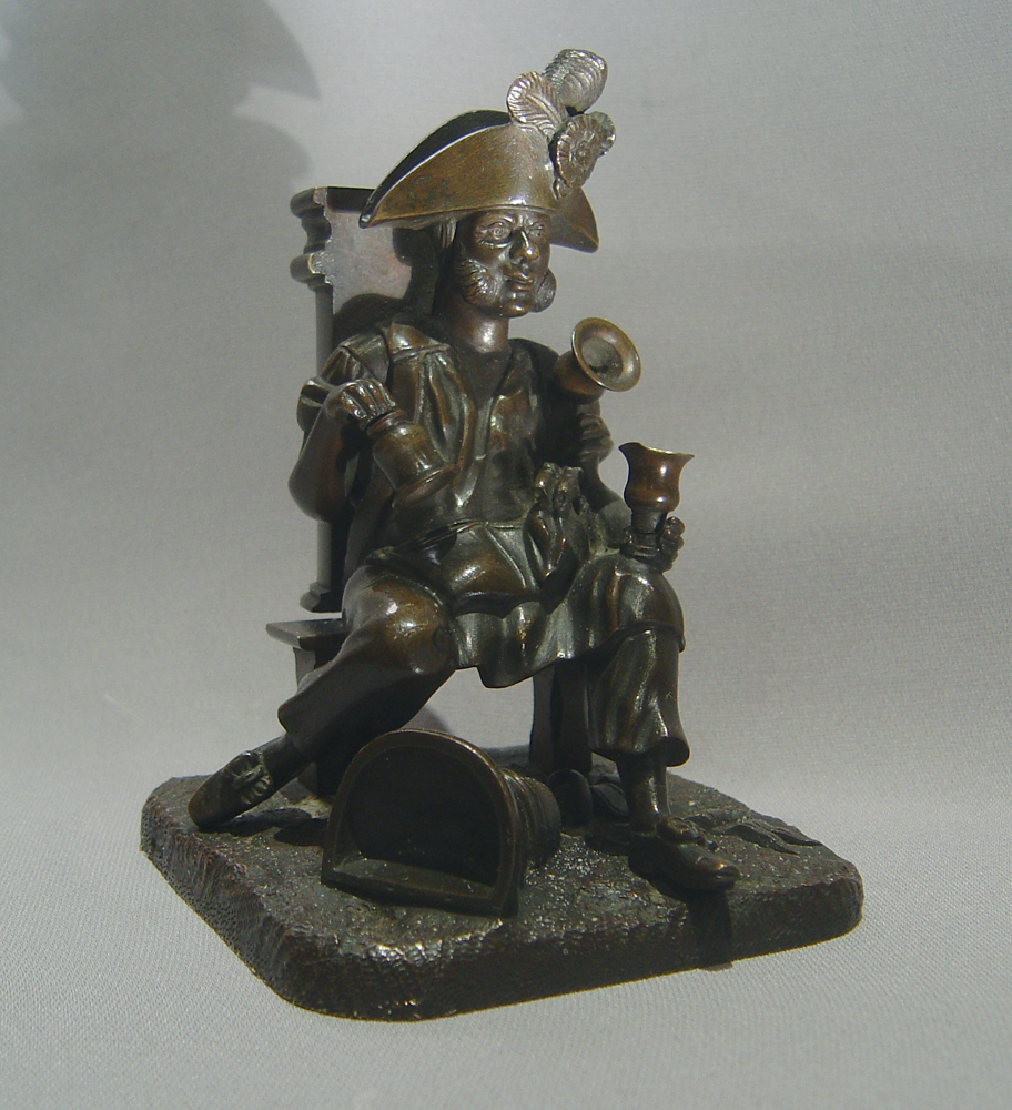 Antique French bronze match strike in the form of an  old soldier as a water seller.