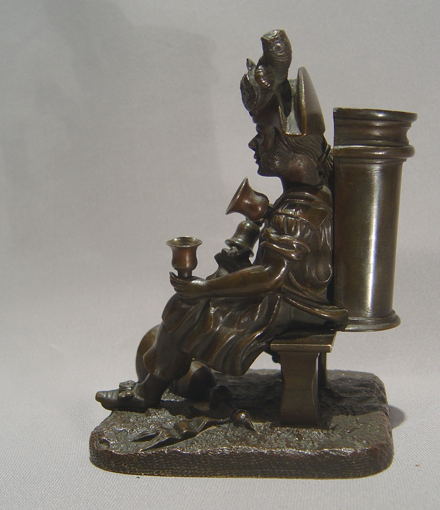 Antique French bronze match strike in the form of an  old soldier as a water seller.
