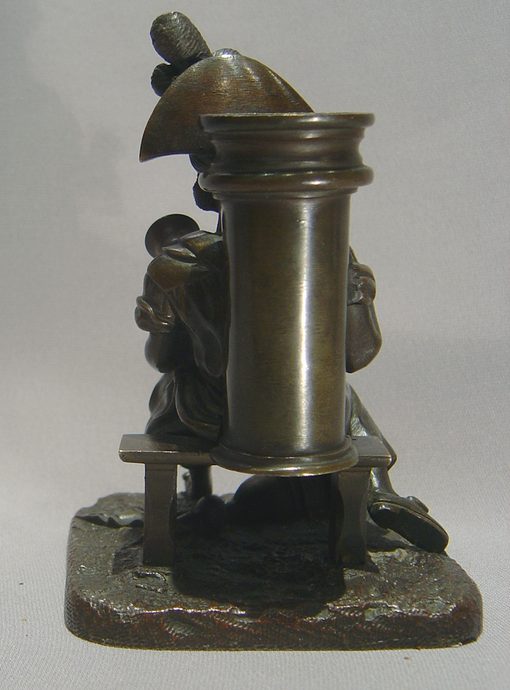 Antique French bronze match strike in the form of an  old soldier as a water seller.