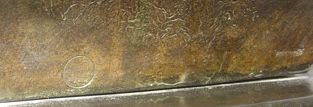 Large bronze bust of male on marble base.