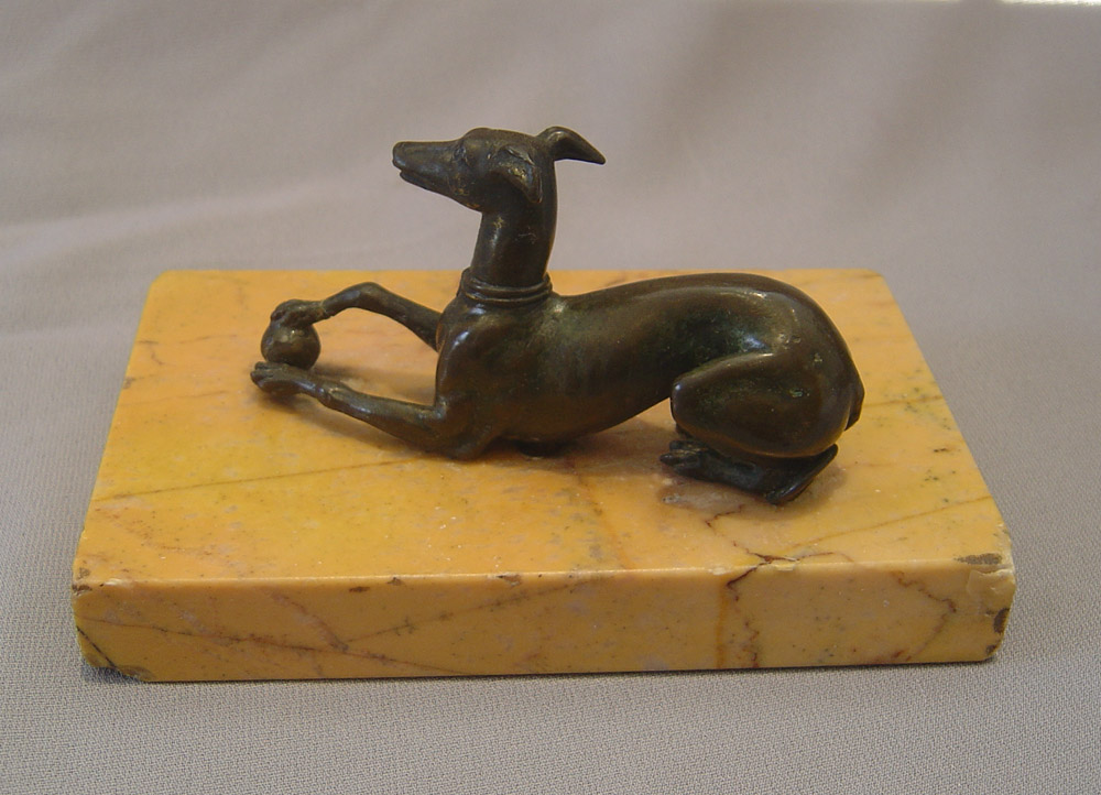 Recumbant greyhound on Sienna marble base