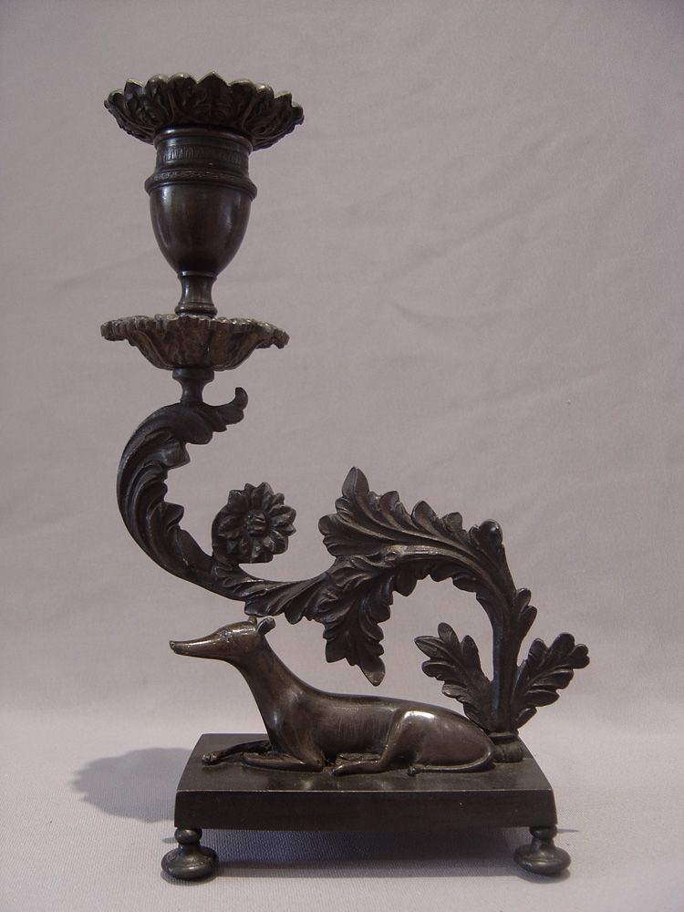 Magnificent antique English Regency pair of patinated bronze greyhound candlesticks.