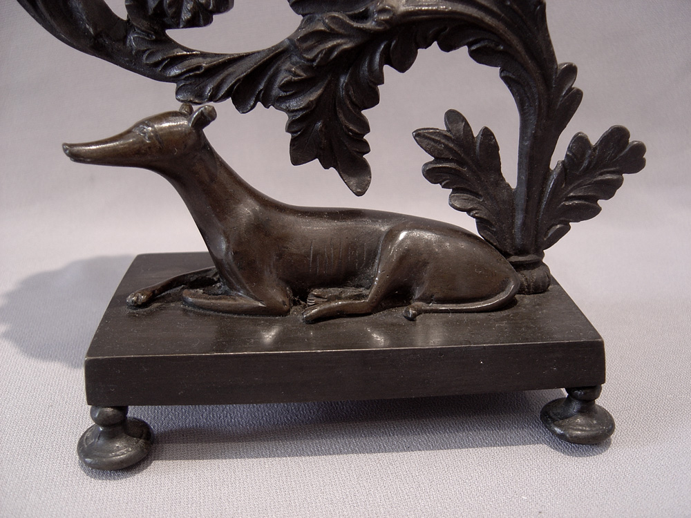 Magnificent antique English Regency pair of patinated bronze greyhound candlesticks.