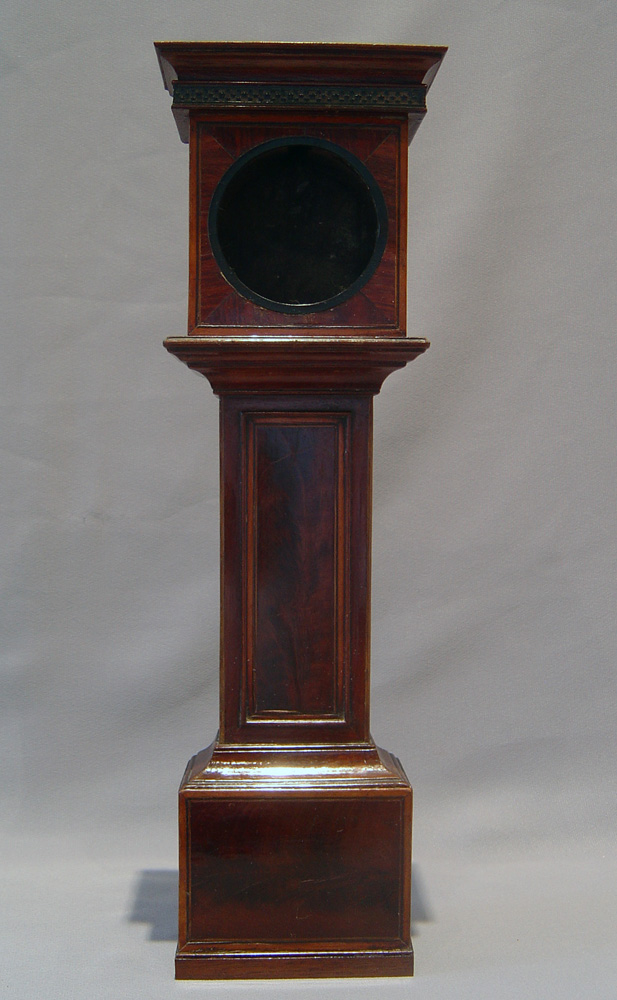 Watch stand in form of inlaid mahogany longcase clock.