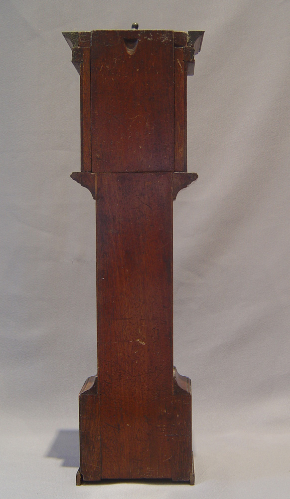 Watch stand in form of inlaid mahogany longcase clock.