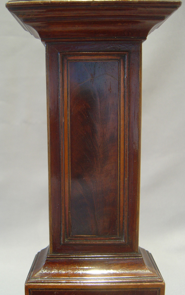 Watch stand in form of inlaid mahogany longcase clock.