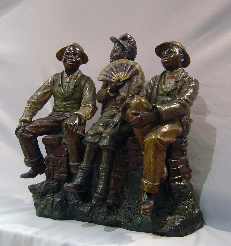 terracotta of three black city boys.