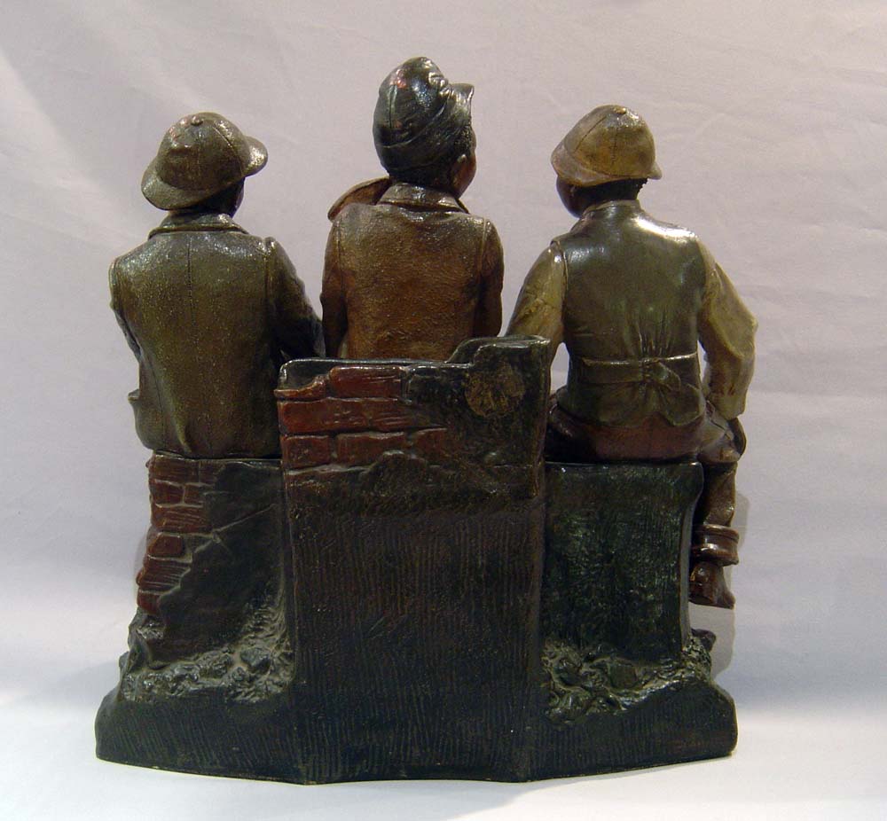 terracotta of three black city boys.