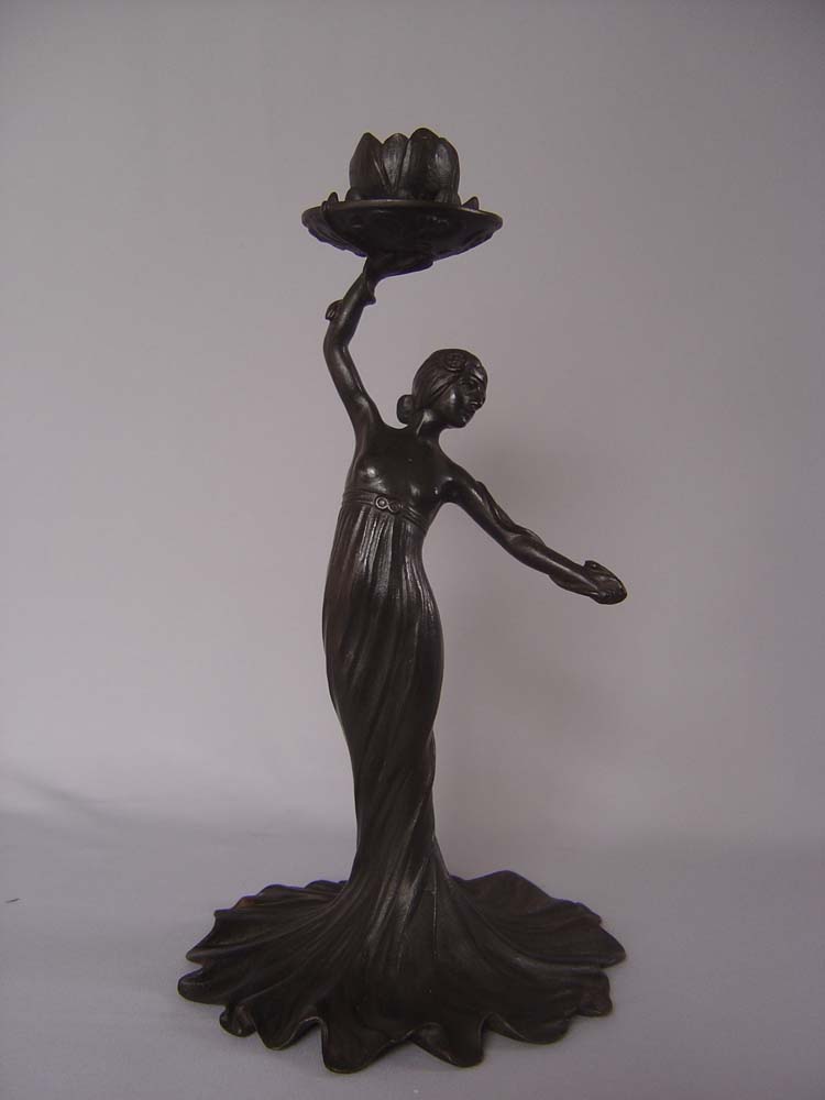 Russian Art nouveau candlesticks, a pair and in cast iron.