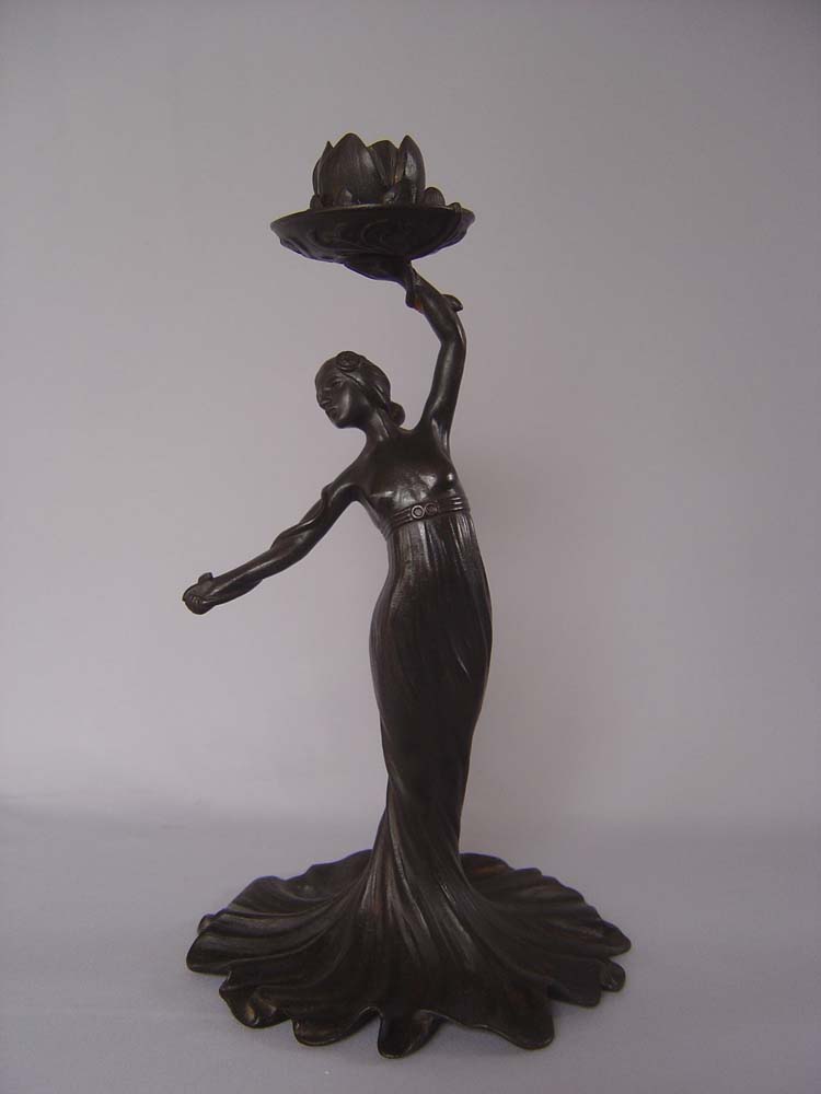 Russian Art nouveau candlesticks, a pair and in cast iron.